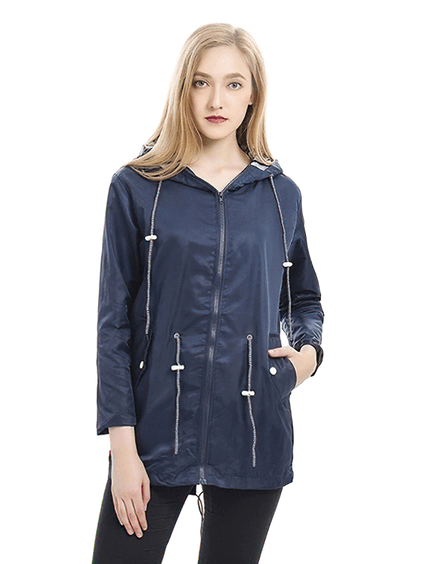 Woman wearing waterproof hooded rain long jacket, windproof outdoor clothing, navy blue, full sleeve, with pockets and hooded collar.